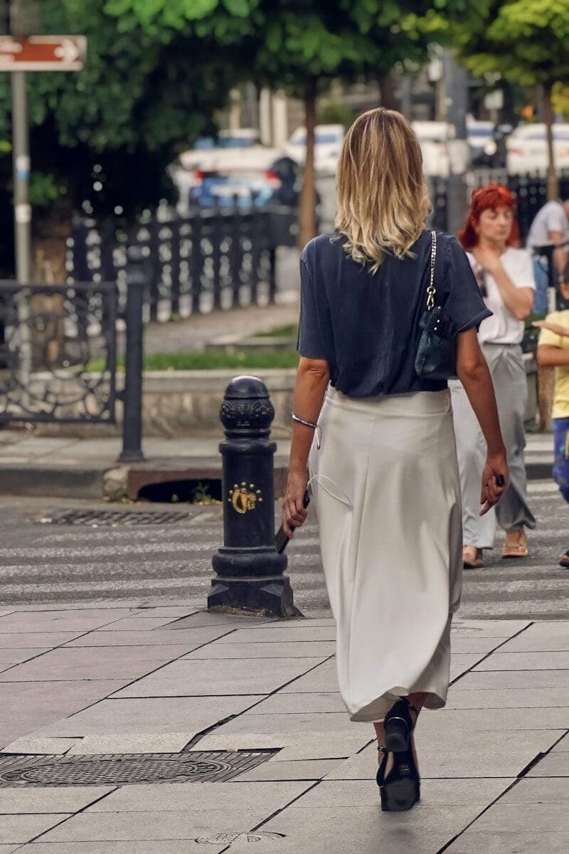 a person walking down a sidewalk