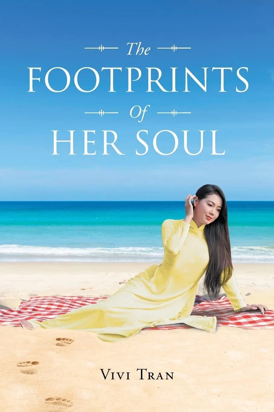 The Footprints Of Her Soul by Vivi Tran book cover, a woman in an ao dai on a beach with footprints in the sand