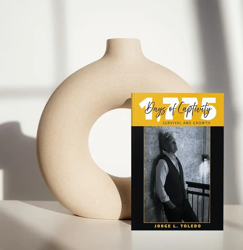 Jorge L. Toledo memoir 1,775 Days of Captivity: Survival and Growth, cover shown standing on a shelf